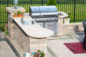 Outdoor Kitchens Boca Raton FL Beautiful outdoor kitchen constructed from paver stones. Built-in grill and sink areas