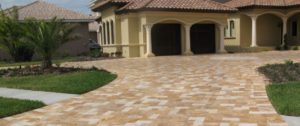 Driveway Installation Deerfield Beach FL Paver driveway leading to front of luxury home with multi-car garage